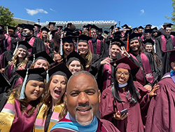 Chancellor Lane on steps with SIU Graduates after Commencement